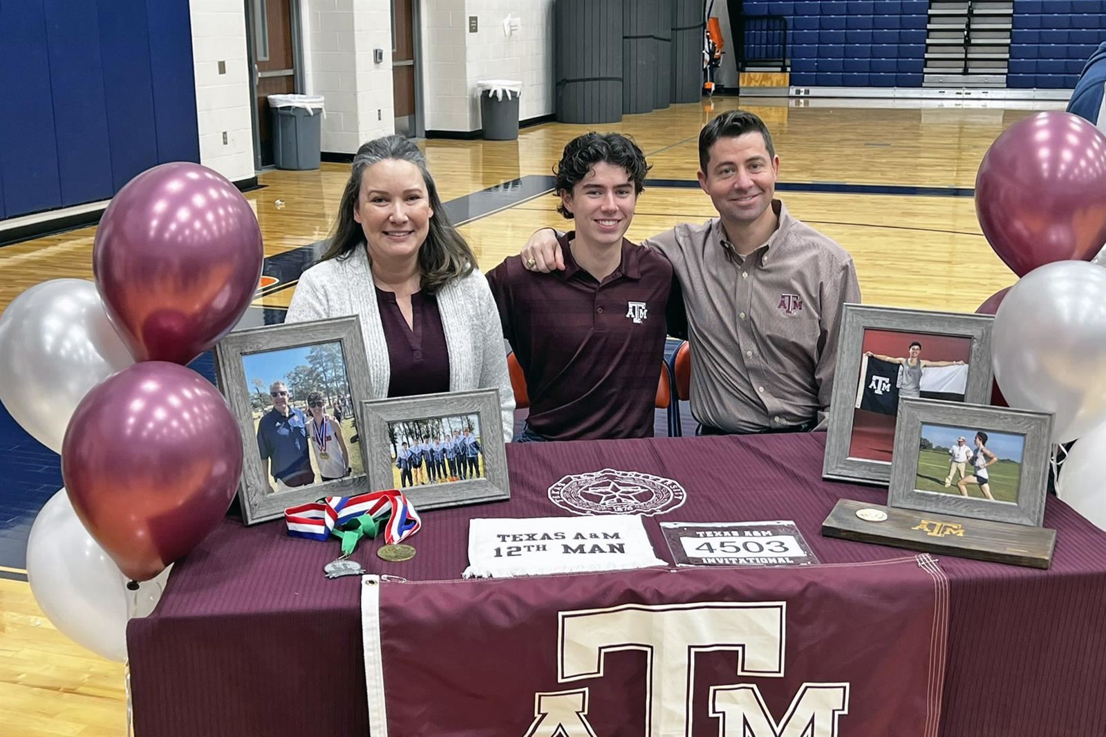 Bridgeland High School senior Noah Willows, center, signed a letter of intent to run cross country at Texas A&M University.